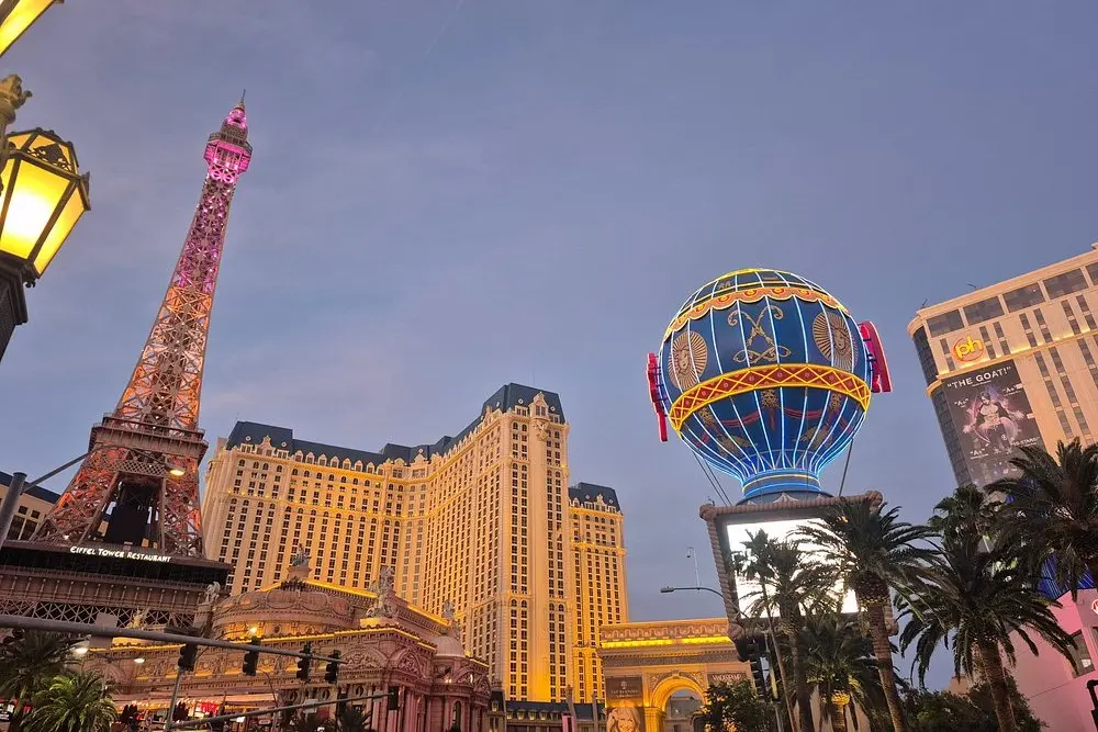 Neon lights and replicas of the Eiffel Tower and balloon at The Las Vegas Strip.