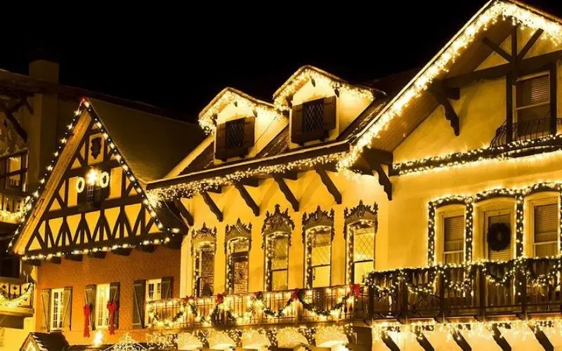 Buildings decorated with bright holiday lights at the Christmas Lighting Festival.