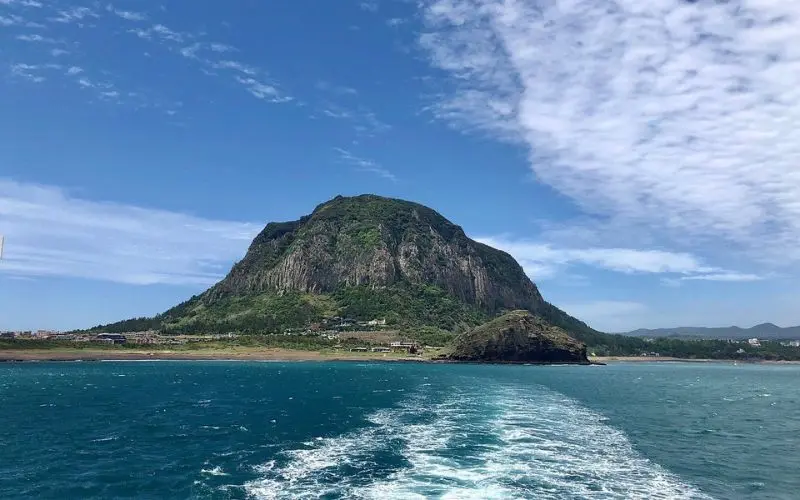A volcanic mountain by the sea on Jeju Island.