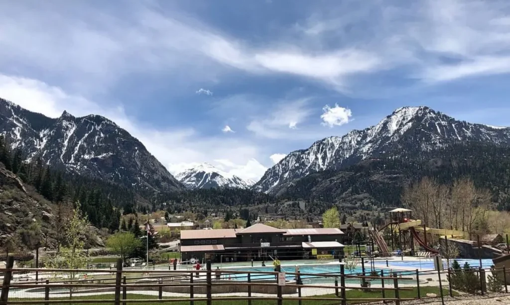 Ouray’s Natural Hot Springs with pools and snow-capped mountains in the background.