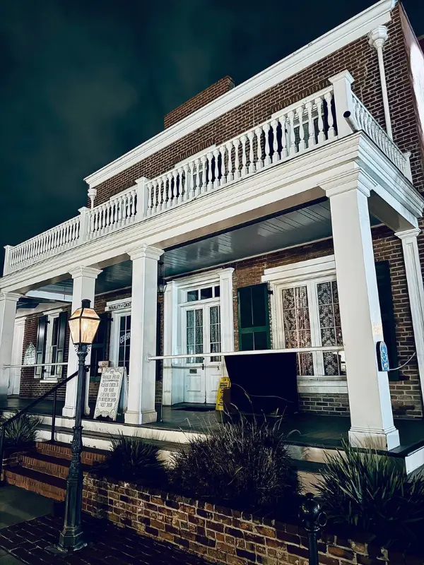 The historic Whaley House Museum stands lit at night.