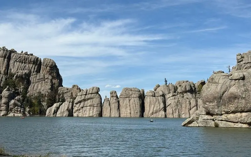 Towering granite spires reflect in the lake at Custer State Park.