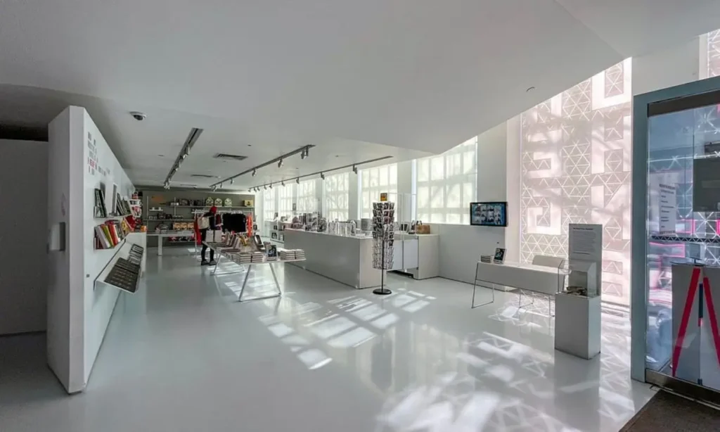 The Museum of the Moving Image gift shop is filled with books, merchandise, and bright natural light.