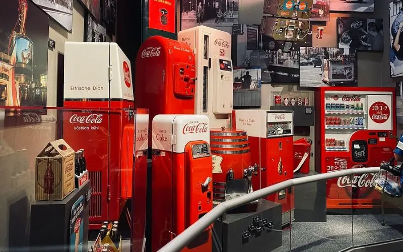 Display of vintage Coca-Cola machines and memorabilia at the World of Coca-Cola.