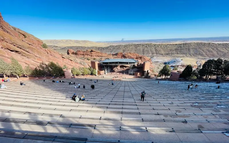 Red Rocks Amphitheatre is an outdoor concert venue surrounded by red rocks.