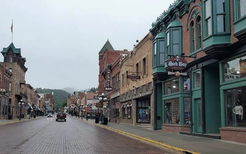 A quiet street lined with historic buildings in Deadwood.
