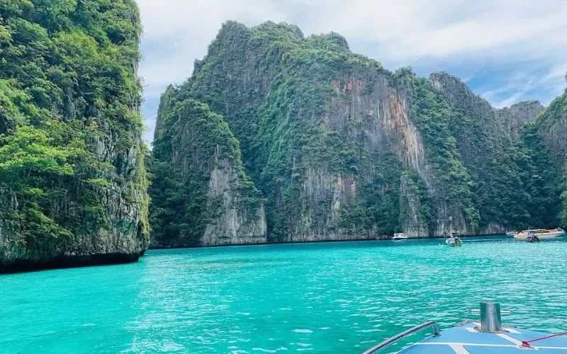 Limestone cliffs rise above turquoise waters in Krabi.
