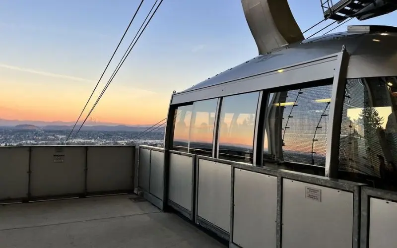 Portland Aerial Tram with city and mountain views at sunset.
