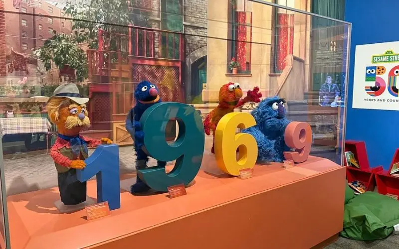 Colorful Sesame Street puppets on display at the Center for Puppetry Arts.