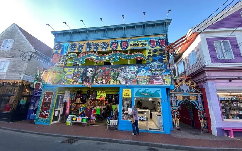 Brightly painted storefronts and murals along Commercial Street.