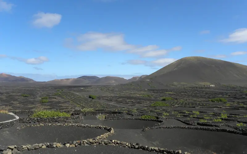 Volcanic landscape with stone circles and hills on Lanzarote.
