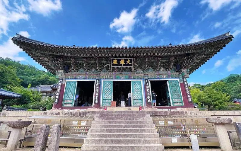 An ornate Buddhist temple building in Daegu.