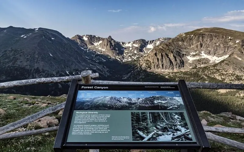 Scenic viewpoint with sign at Forest Canyon Overlook.