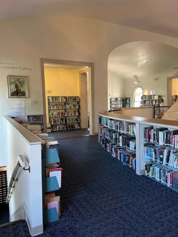 Bookshelves and reading areas inside Provincetown Library’s upper level.