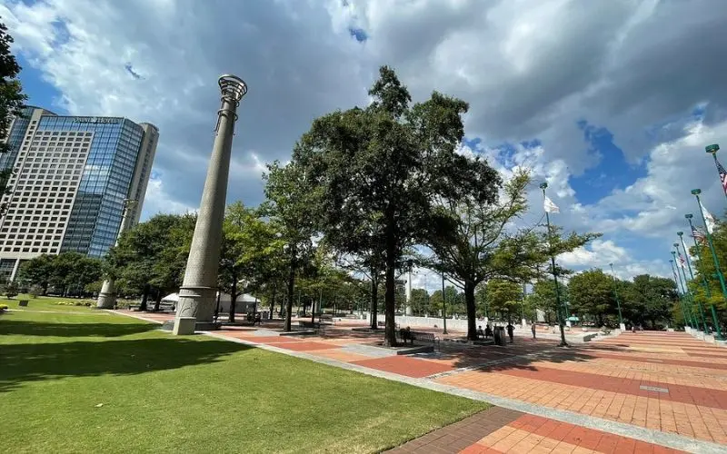 Open plaza with trees and columns at Centennial Olympic Park.