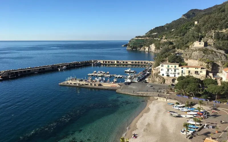 Marina with boats and beach along the coast of Cetara.