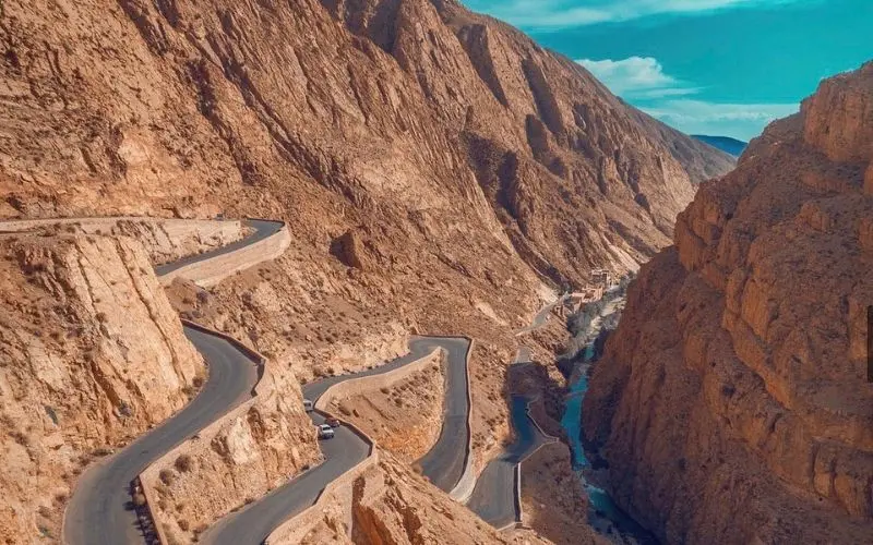 Winding mountain road through the rocky Dades Valley.