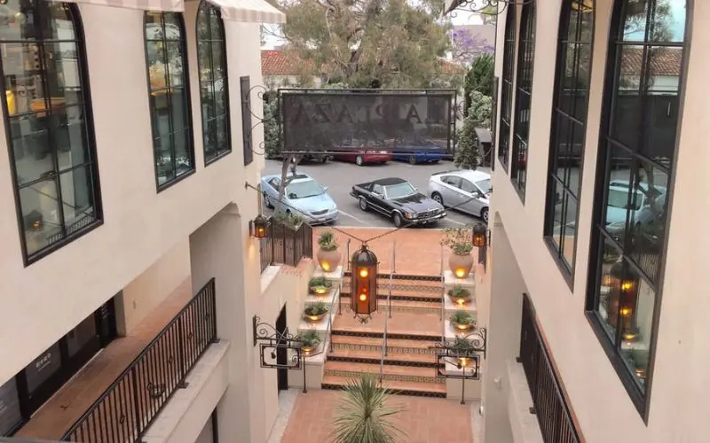 Courtyard entrance with Spanish-style design at La Plaza La Jolla.