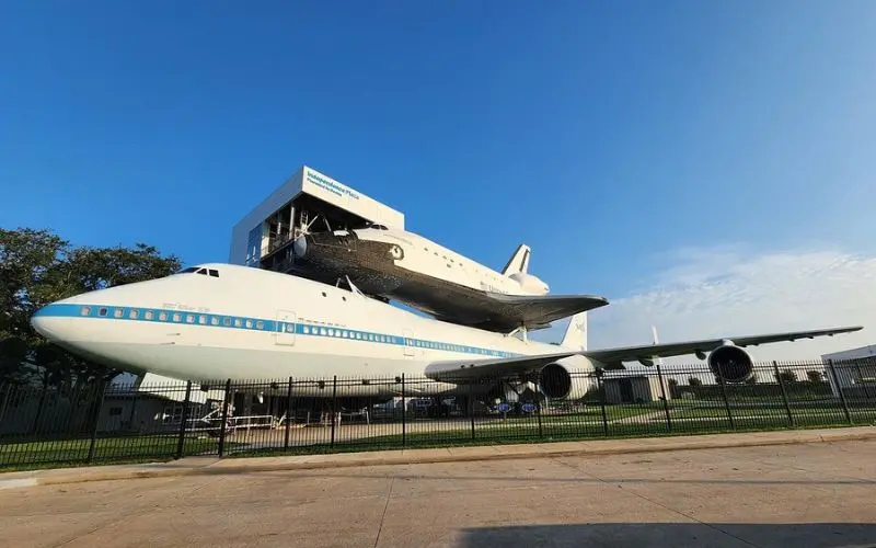 A space shuttle rests atop an airplane at Space Center Houston.
