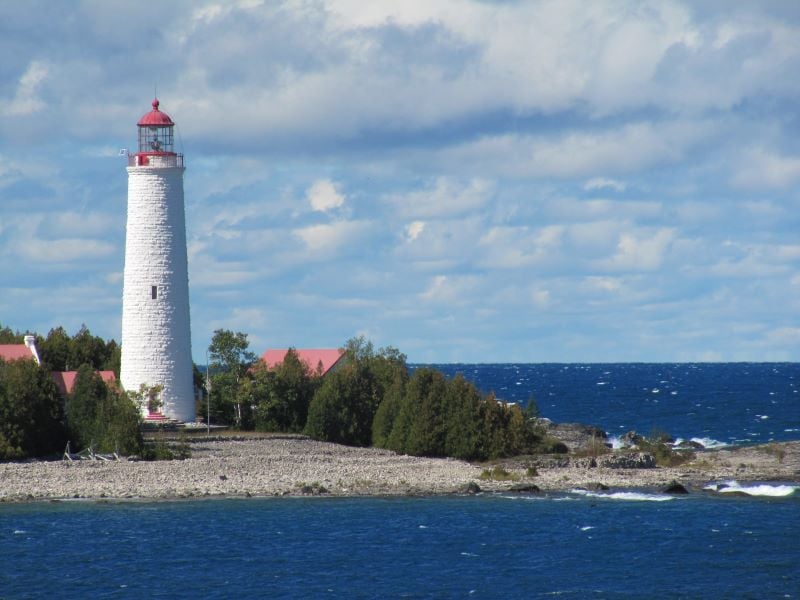 A breathtaking view of Bruce Peninsula National Park's turquoise waters and a blue sky