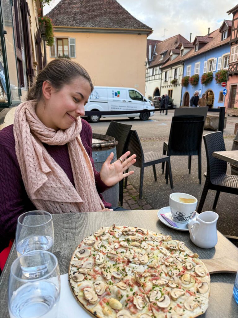 My wife enjoying Flammekueche in Eguisheim