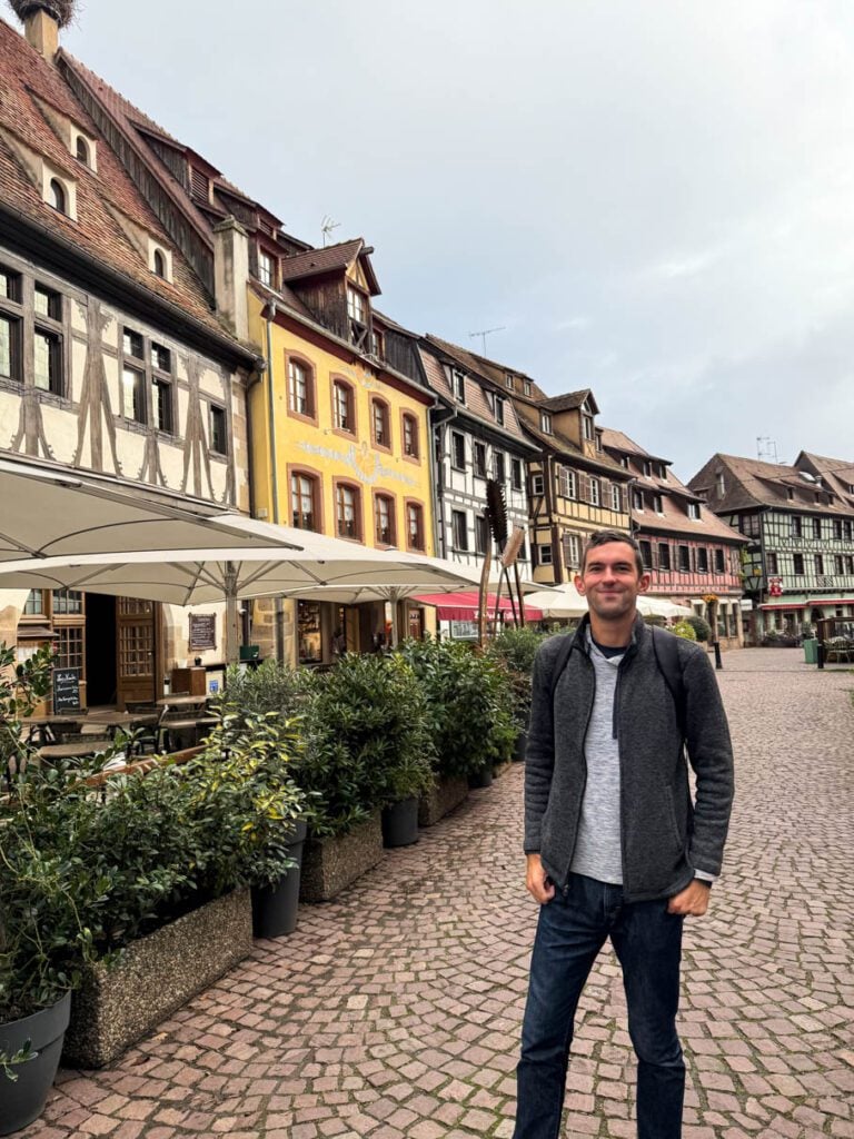 Me standing in front of Obernai's iconic restaurants