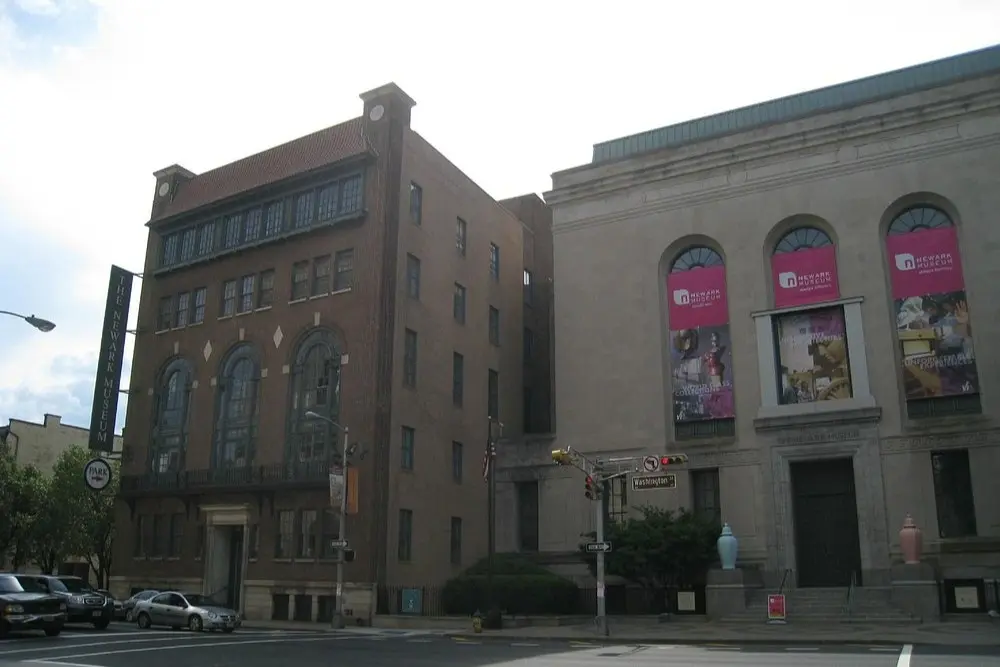 The Newark Museum of Art in New Jersey features a historic facade with banners promoting current exhibits.