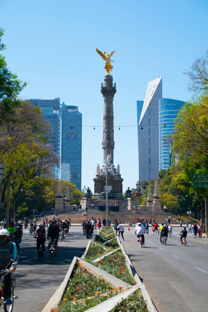 Angel of Independence monument in Mexico City surrounded by cyclists on Paseo de la Reforma