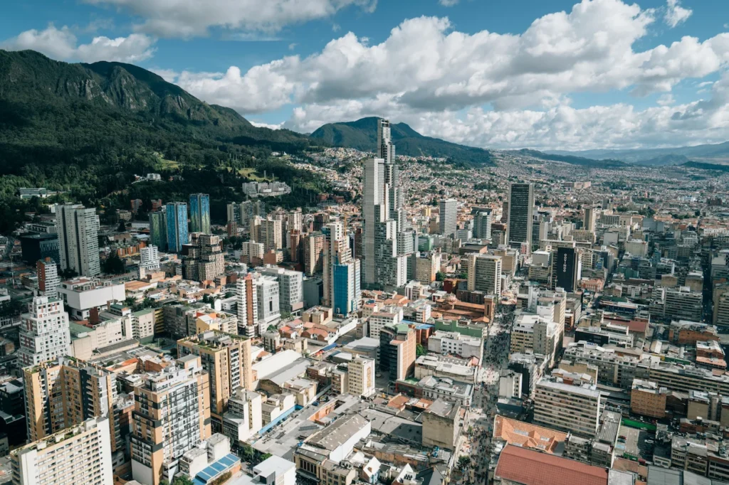 Aerial view of the Bogotá skyline and BD Bacatá tower under the Andes mountains in Colombia