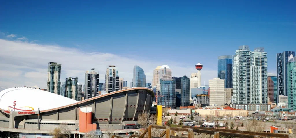 Downtown Calgary skyline featuring the Calgary Tower and the Scotiabank Saddledome arena
