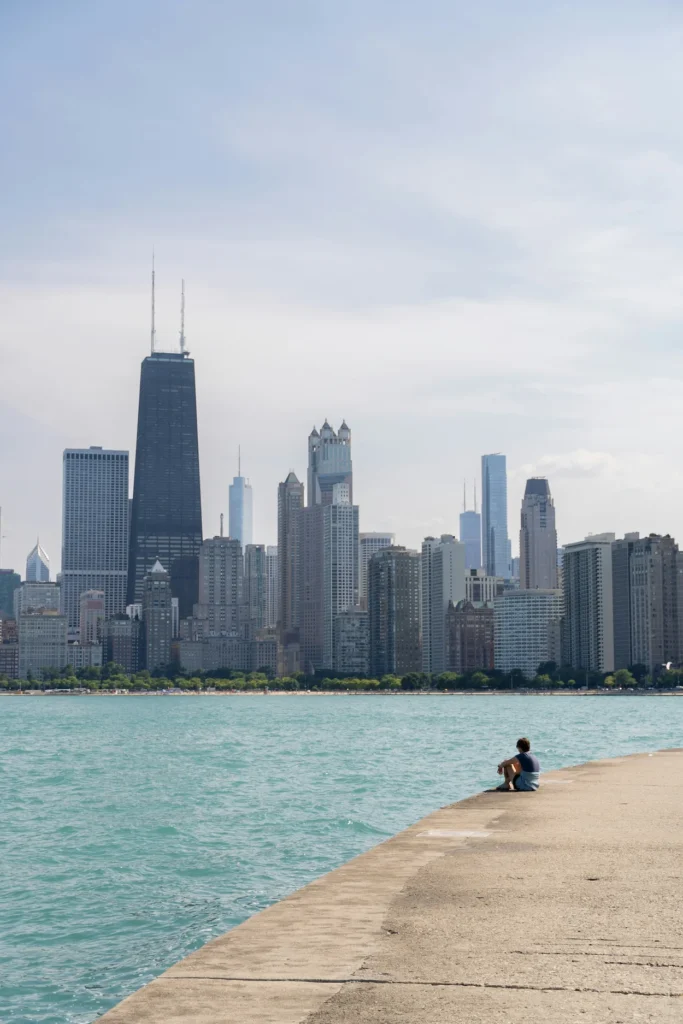 Chicago city skyline including the 875 North Michigan Avenue building viewed across the blue water of Lake Michigan