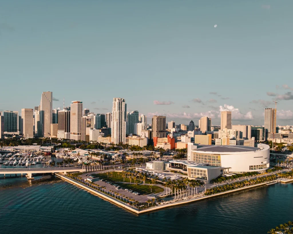 Miami skyline looking across the Biscayne Bay waterfront toward the distinct Kaseya Center arena structure