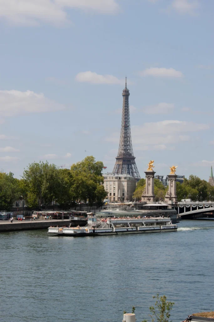 Tour boat on the Seine River with the Eiffel Tower background