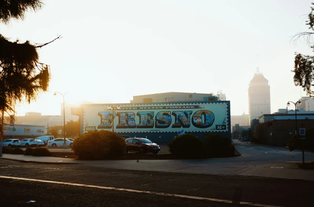 Fresno postage stamp with the city skyline blurred in the hazy background at sunset