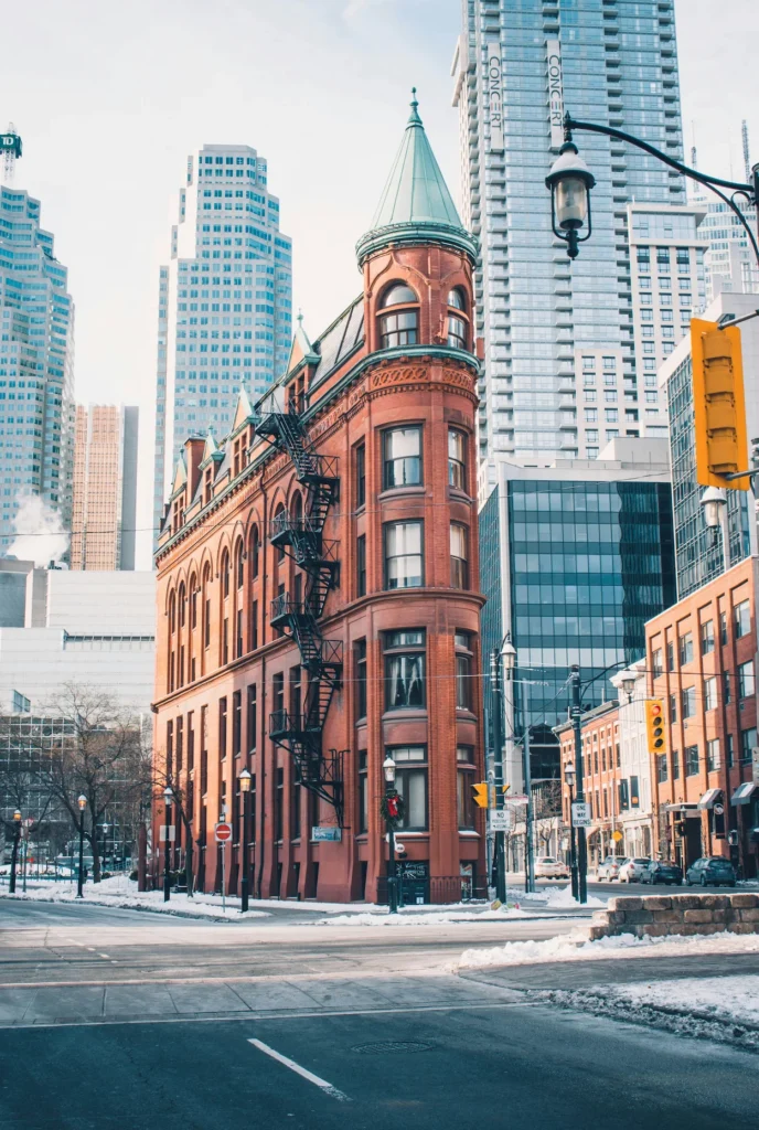 Gooderham Flatiron Building in Toronto framed by modern skyscrapers