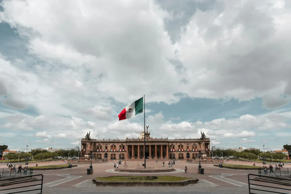 Mexican flag flying in front of the Government Palace at Macroplaza in Monterrey