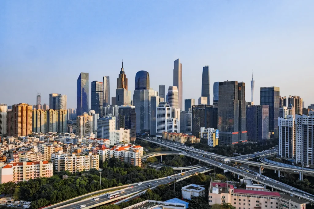 Guangzhou skyline featuring Zhujiang New Town skyscrapers and the Canton Tower under a clear sky