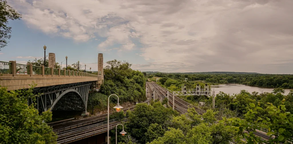 The historic stone and steel High Bridge overlooking railway tracks and the river