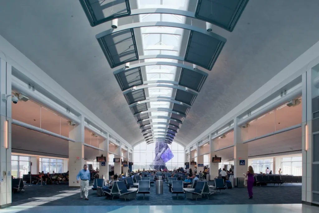 The barrel-vaulted skylight ceiling and waiting gates inside Jacksonville International Airport Concourse A