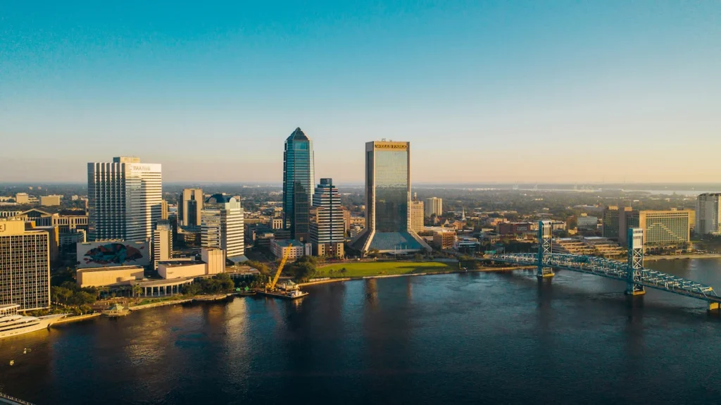 Aerial view of Jacksonville skyscrapers and the blue Main Street Bridge along the river
