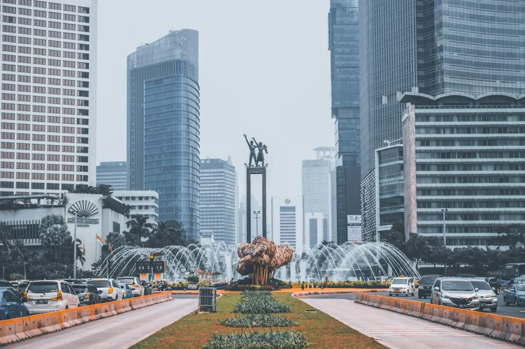 Selamat Datang Monument statue and circular fountain surrounded by skyscrapers in Jakarta