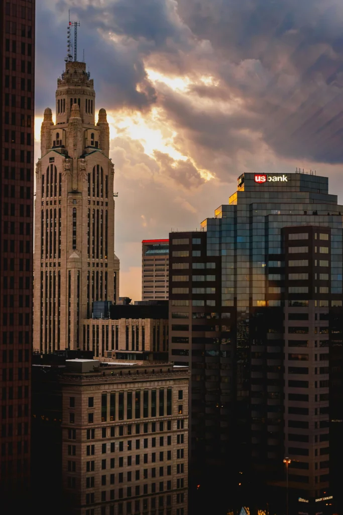 LeVeque Tower alongside modern skyscrapers in the Columbus, Ohio skyline at sunset