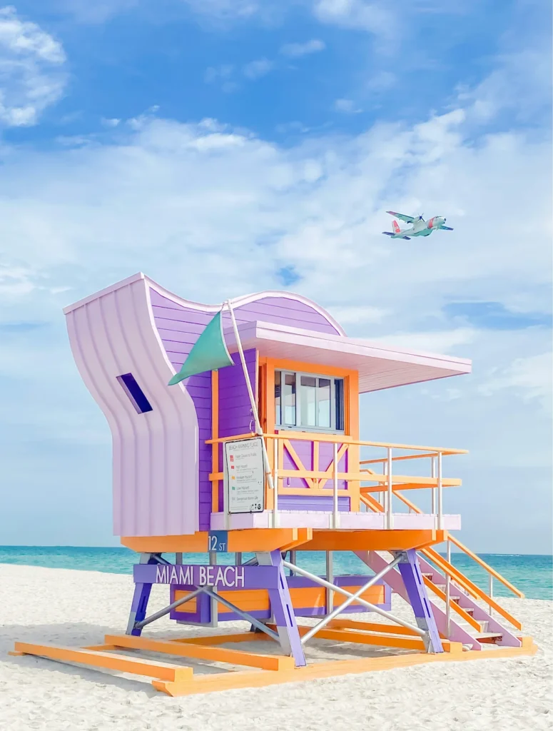 Colorful pink and purple 12th Street lifeguard tower on the sand at Miami Beach