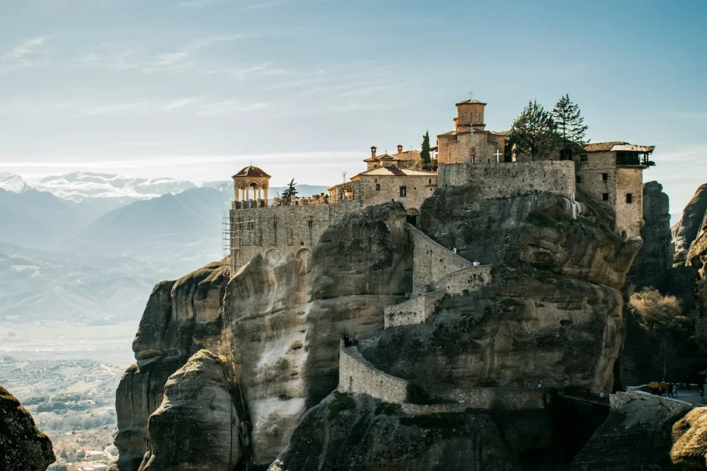 Monastery of Varlaam perched precariously on a massive rock pillar in Meteora, Greece