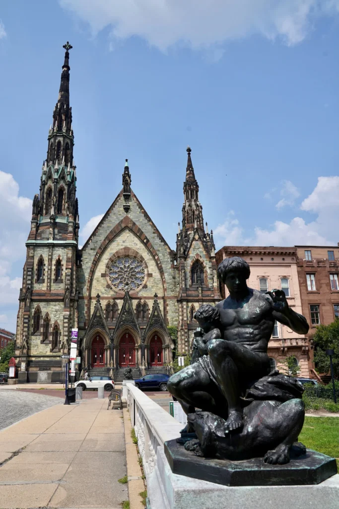 Mount Vernon Place United Methodist Church facade behind a bronze statue in Baltimore