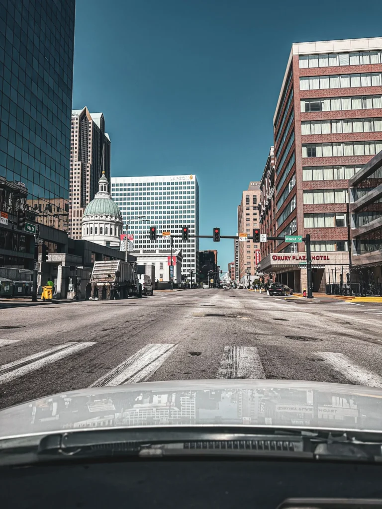 Downtown St. Louis intersection looking toward the white dome of the Old Courthouse