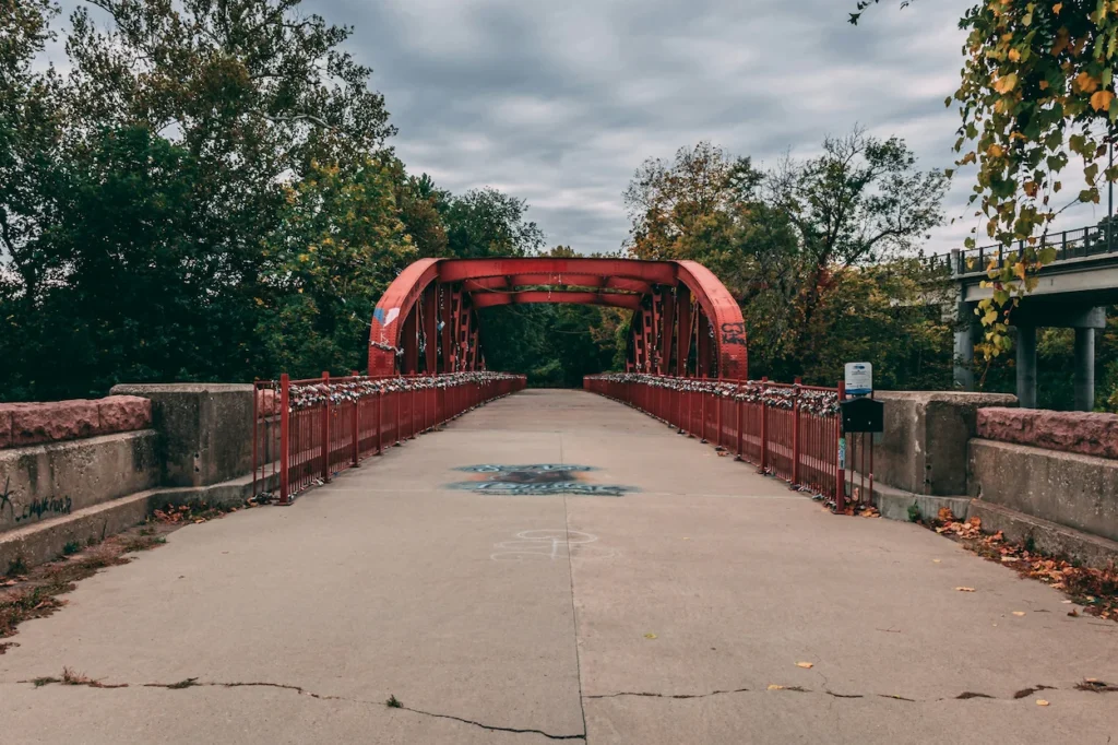 The historic Old Red Bridge pedestrian walkway covered in love locks