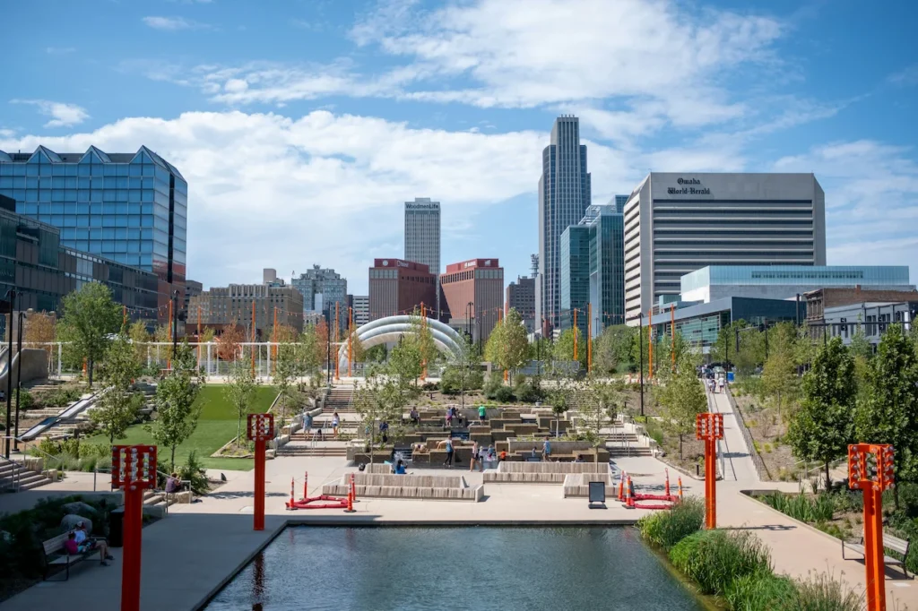 Downtown Omaha skyline viewed from the green spaces and walkways of Gene Leahy Mall