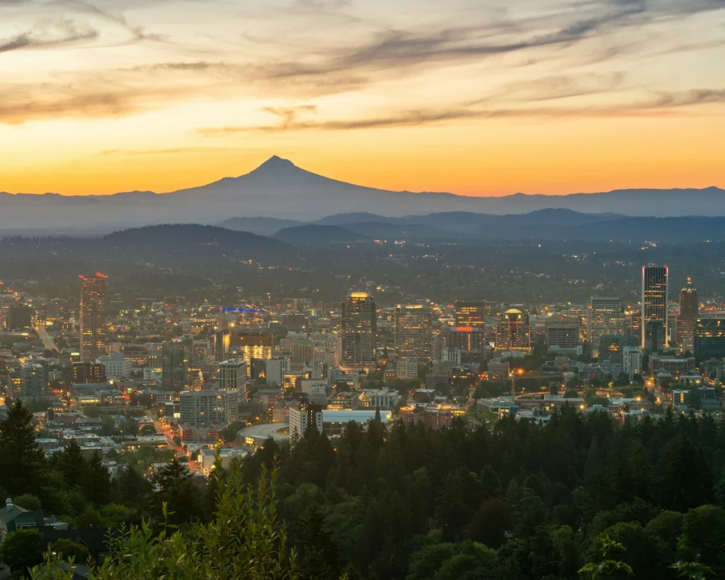 Portland city skyline at dawn with Mount Hood rising in the background