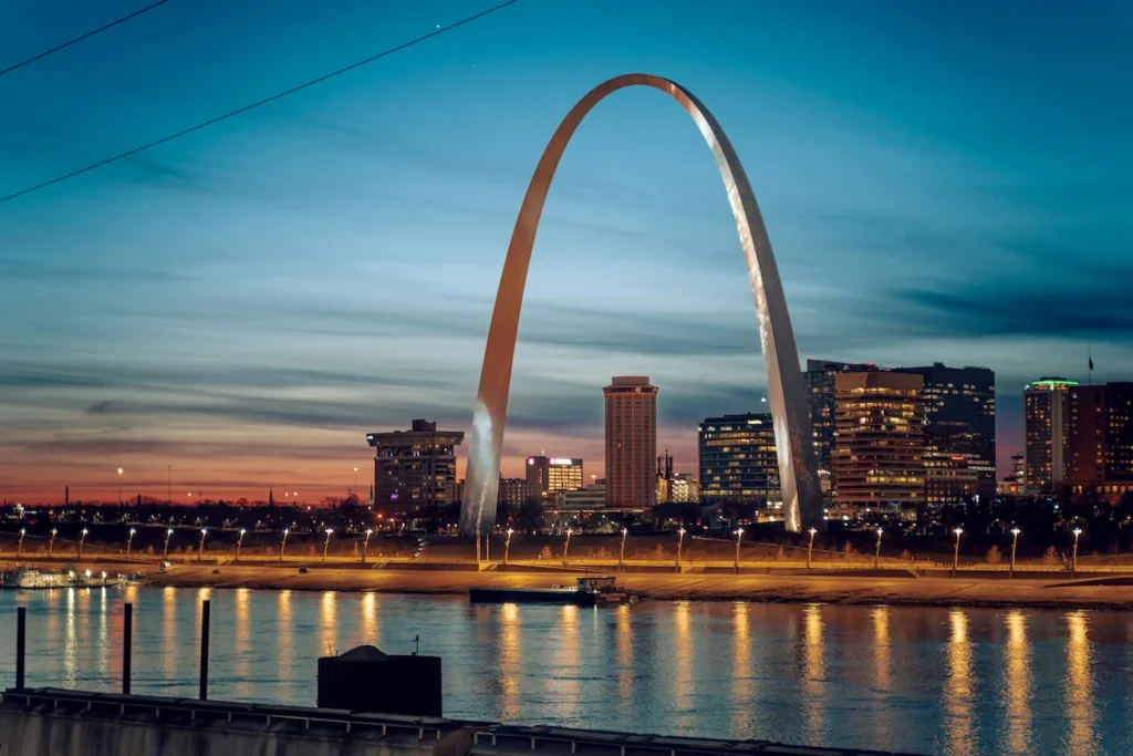Gateway Arch and downtown St. Louis skyline at sunset across the Mississippi River
